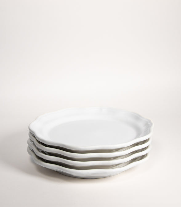 4 LOW PLATES MADE OF HANDMADE WHITE EARTHENWARE